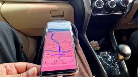Placing a mobile phone on human thigh with location app open, while travelling. Stock Footage 341162862