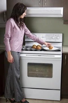 Placing muffins Stock-Fotos