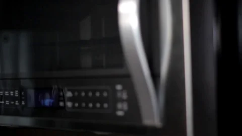 Placing a Mug in a Microwave.   Stock Footage 91017358