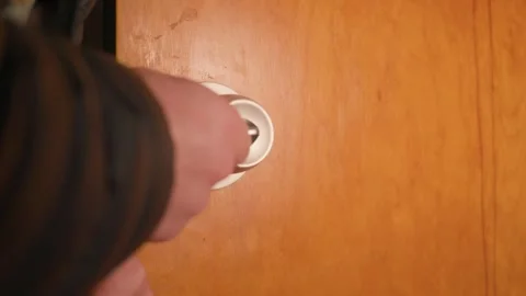 Placing the new knob into the hole after resizing. Video stock 327308589