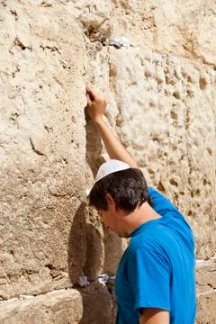 Placing a note in the wailing wall Stock Photos