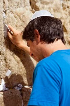 Placing a note in the wailing wall Stock Photos