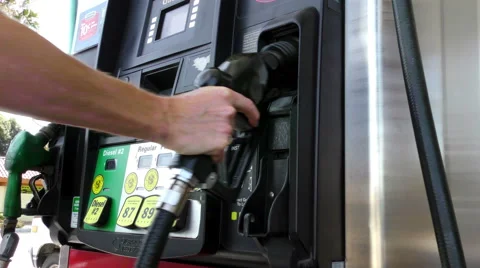 Placing Nozzle in Holder at Gas Pump Stock Footage 49581990