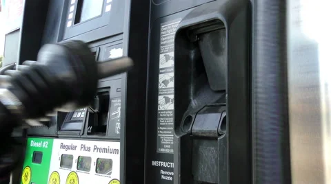 Placing Nozzle in Holder at Gas Pump Stock Footage 49582076