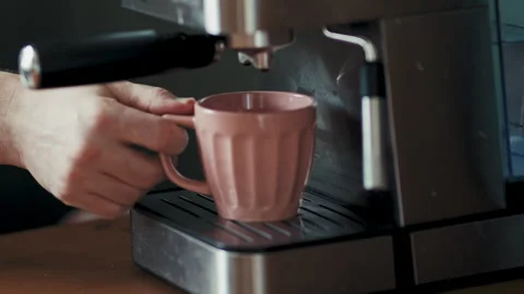 Placing Pink Mug under Coffee Machine Spout Stock Footage 346637407