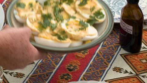 Placing Plate Of Deviled Eggs On Table 스톡 동영상 115806686