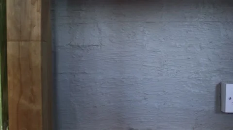 Placing plug in wall socket under desk Stock Footage 64046360