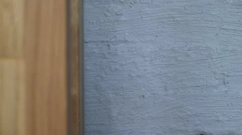 Placing plug in wall socket under desk Stock Footage 64046382