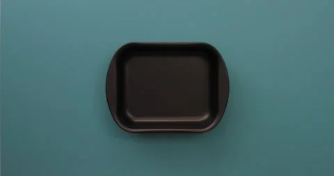 Placing potato halves in a pan 2 Video stock 132149224