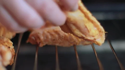 Placing Raw Chicken Wings on a Wire Rack Stock Footage 86161933
