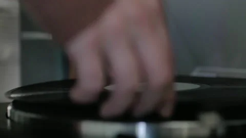 Placing record on record player Stock Footage 169062654