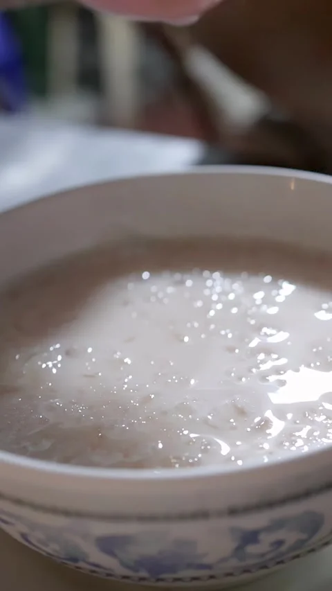 Placing Red Ruby Dessert in Coconut Milk Street Food Bowl 스톡 동영상 317082599