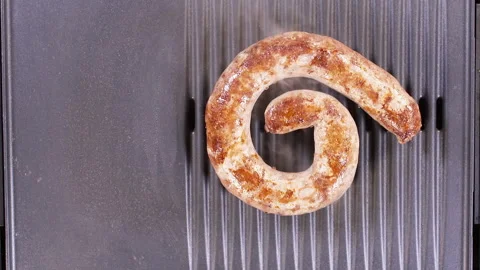 Placing Ring Sausage On Grill Stock Footage 248744877