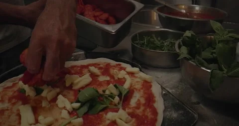 Placing Salami on Pizza Base Stock Footage 148130466