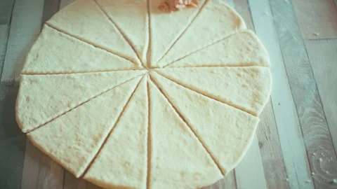 Placing savory ham and cheese filling on dough triangles close up, baking Stock Footage 337877942