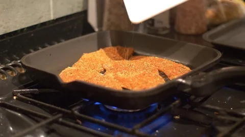 Placing Spiced Chicken in a Griddle Pan Stock Footage 85300302
