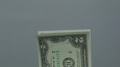 Placing a stack of two dollars bills Stock Footage 71329497