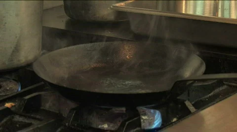 Placing Steak in Skillet Stock Footage 334960