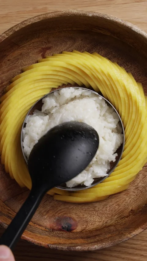 Placing Sticky Rice Into Plate Vertical Top View Close Up Видео 335775082