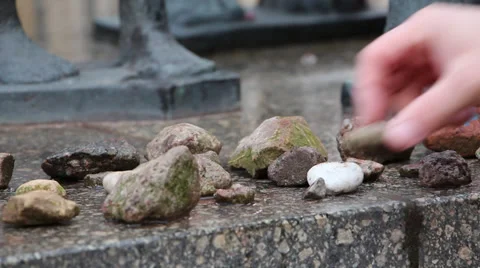 Placing a stone graveyard Stock Footage 32896466