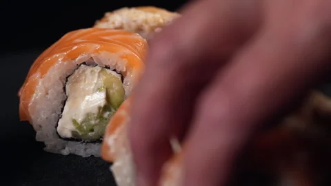 Placing sushi rolls on a plate. Stock Footage 311718334