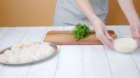 Placing on table scallops and ingredients for cooking in 4k. Stock Footage 138058726