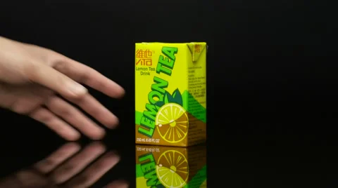 Placing Tea Carton on reflective surface Video stock 61325755