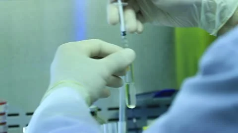 Placing test tube in tray Stock Footage 20450163