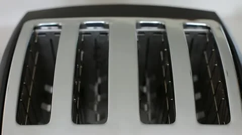 Placing Toast In Toaster Centered Stock Footage 10942186