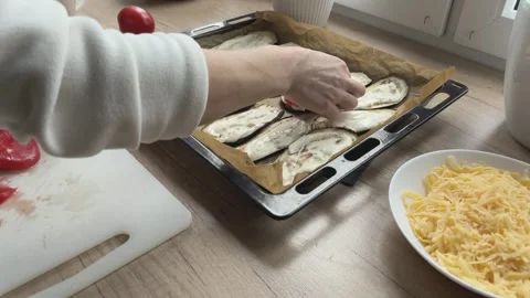 Placing Tomato Slices On Eggplant On Baking Tray Preparing Dish For Oven Close 스톡 동영상 336445634
