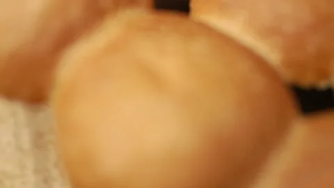 Placing the top half bread rolls on beef slider. Stock Footage 135464522