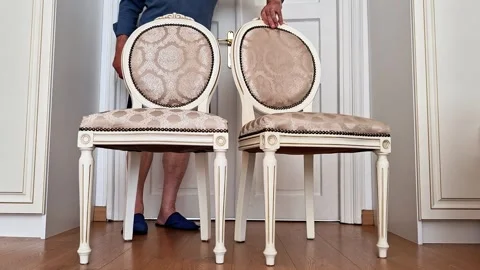 Placing Two Elegant Upholstered Chairs Side by Side Vídeos de archivo 340382850