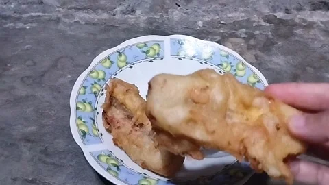 Placing Two Fried Bananas on a White Glass Plate Stock Footage 321785957