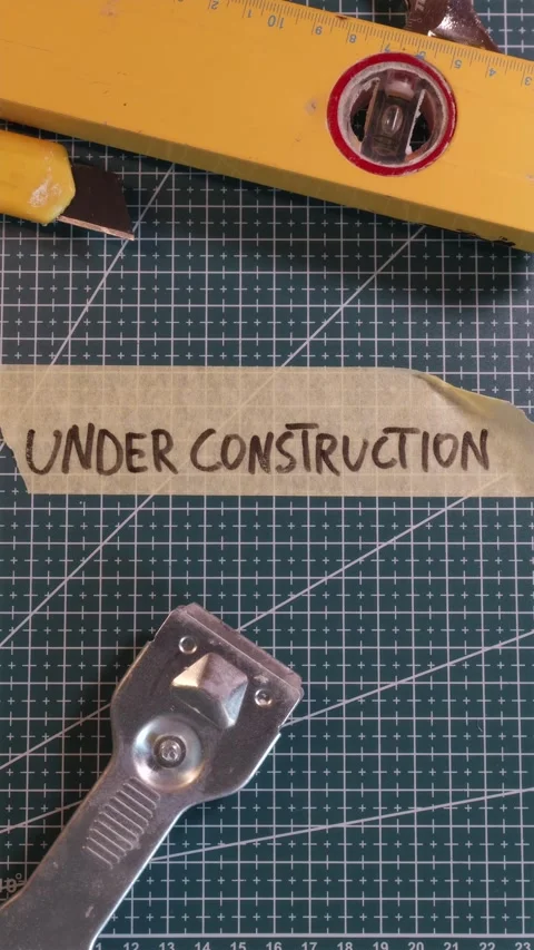 Placing UNDER CONSTRUCTION tape near scraper tool. Stock Footage 337816358