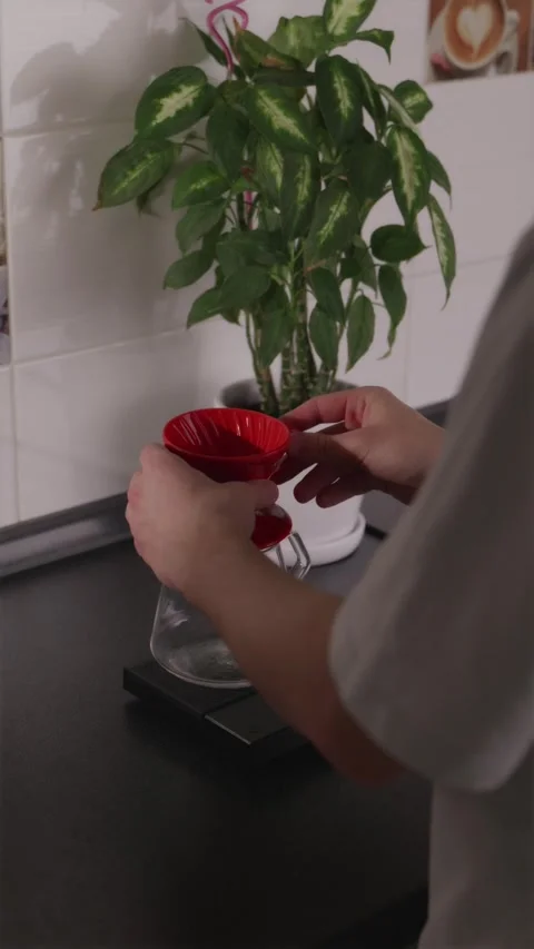 Placing V60 dripper on glass server from a high angle Stock Footage 332720152