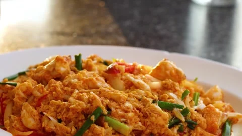 Placing a Vibrant Crab Dish on Table Stock Footage 308682162