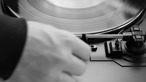 Placing vinyl record on a turntable - black and white Stock Footage 149072574