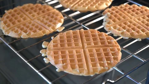 Placing Waffles on Cooking Rack Stock Footage 123479482