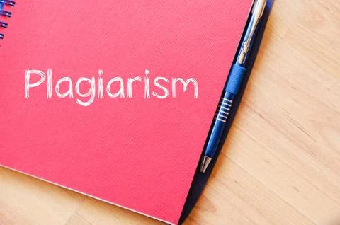 Plagiarism write on notebook Stock Photos