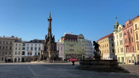 Plague column on historic square in Olomouc, tourists and people walking Stock Footage 263483638