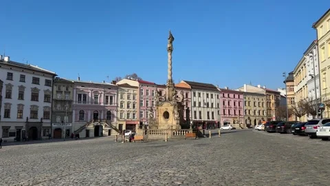 Plague column on historic town square in Olomouc, people and urban life Stock Footage 263483681