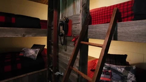 Plaid patterned bunk beds and ladder Stock Footage 82440359