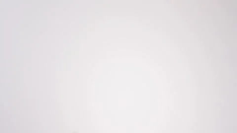 Plain bagels raining on white slow motion macro food studio 4K stock Stock Footage 337909823