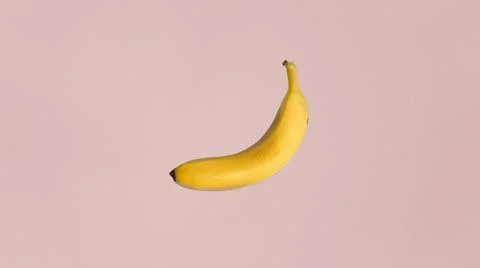 Plain banana on pink background. Stock Illustration