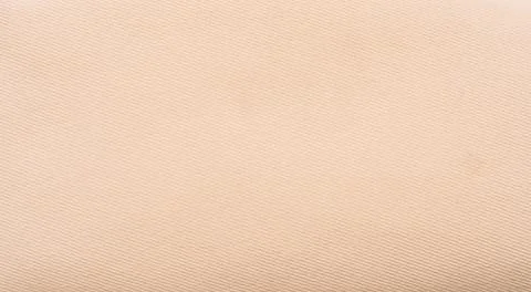 Plain beige fabric texture with soft textile surface, minimal neutral background Stock Photos