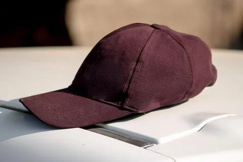 Plain Black Cap Front View,Black cap on outdoor background.side view selectiv Stock Photos
