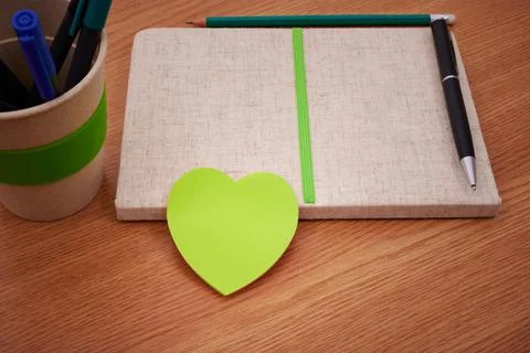 Plain Blank Open Notebooks With Stack Of Pens Inside Container Placed On Top Of 스톡 사진