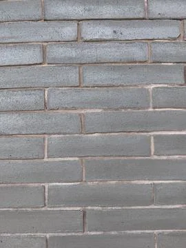 Plain brick wall, gray wall made out of long bricks picture Stock Photos