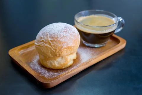 Plain butter bread with icing sugar powder on wooden plate Stock Photos