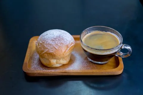Plain butter bread with icing sugar powder on wooden plate Stock Photos